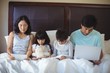 © wavebreak3 - Family using digital tablet, mobile phone and laptop