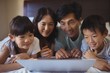 © wavebreak3 - Family using laptop together in bedroom
