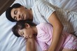 © wavebreak3 - Father and daughter sleeping together in bedroom