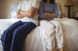© wavebreak3 - Couple ignoring each other in bedroom