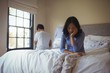 © wavebreak3 - Couple ignoring each other in bedroom