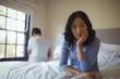 © wavebreak3 - Couple ignoring each other in bedroom