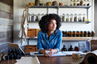 © Trinette Reed/Stocksy - Millennial African American Woman businesswoman in her skincare studio