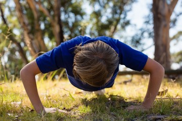 Wall Mural - girl exercising during obstacle course training