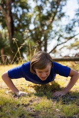 Wall Mural - girl exercising during obstacle course training