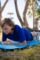 Wall Mural - girl exercising on exercise mat during obstacle course training