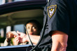 © Sean Locke/Stocksy - Police Woman Pulled Over Hands License To Officer