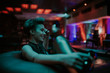 © Boris Jovanovic/Stocksy - Young attractive woman smiling at the club at night