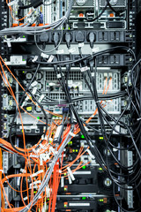 Complex array of wires at back of server cabinet