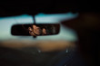 © HOWL/Stocksy - A happy young traveler drives along the open road