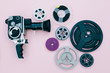 © kkgas/Stocksy - Vintage cinema camera and reels over pink background