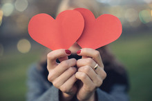Close-up Of Woman's Hands Holding A Red Heart
