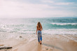 © Studio Firma/Stocksy - Walking on the Beach