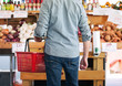 © Sean Locke/Stocksy - Market Rear View Of Man With Basket Shopping For Produce