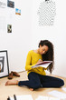 © BONNINSTUDIO/Stocksy - Young university woman studying hard at home