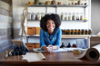 © Trinette Reed/Stocksy - Millennial African American Woman businesswoman in her skincare studio
