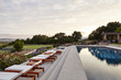 © Trinette Reed/Stocksy - Backyard pool at luxury modern design home