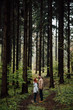 © Boris Jovanovic/Stocksy - Couple standing in the middle of the forest