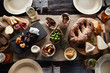 © Trinette Reed/Stocksy - Food items at a rustic dinner picnic party on wood table