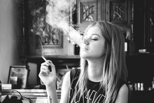 Young Woman Smoking A Cigarette