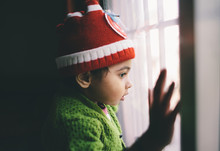 Toddler Looking Out The Window