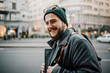 © Boris Jovanovic/Stocksy - Close up of a young bearded man on the street