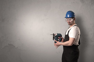 Craftsman standing in front of an empty wall.