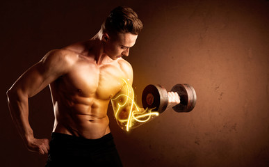 Muscular body builder lifting weight with energy lights on biceps