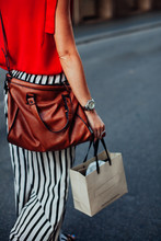 Woman Carrying A Shopping Bag