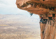 © Micky Wiswedel/Stocksy - Traditional rock climbers climbing a huge overhanging roof on a high mountain