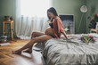 © Lumina/Stocksy - Pregnant Woman Sitting on the Bed in Her Bedroom