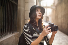 Portrait Of A Young Tourist Woman Taking Photos On Barcelona Streets