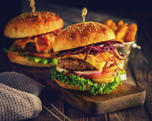 Delicious homemade hamburger on wooden background