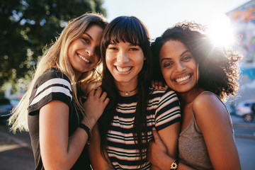Wall Mural - Beautiful female friends looking happy together