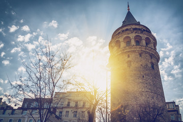 Wall Mural - Turkey, Istanbul, Galata tower in the rays of the setting sun