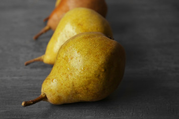 Wall Mural - Fresh pears on grey stone background