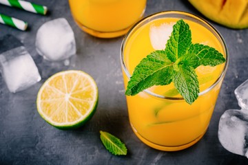 Wall Mural - Fresh summer mango cocktail with lime and mint