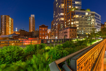 the high line on a summer evening in the heart of chelsea (here at the intersection of 10th avenue a