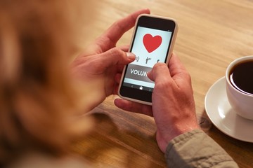 Wall Mural - Composite image of volunteer text with heart shape