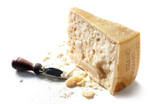 Slice Of Parmesan Cheese With Knife Over White Background
