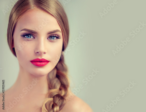 Fotografering Beautiful young woman with braid hair and red lips