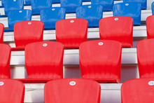 Red And Blue Plastic Seats On The Grandstand