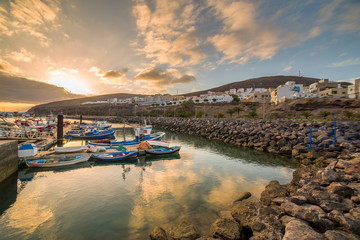 Wall Mural - Sunset over a port in Gran Tarajal, Fuerteventura, Canary islands