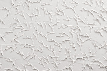 Wall Mural - White decorative abstract plaster texture with cracks, splash, footprints.
