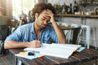 © WHstudio Leushin N - Tired Afro American college student with curly hairstyle blowing out his cheeks looking bored or fed up, losing patience while failing to solve complicated mathematical problem, doing home assignment