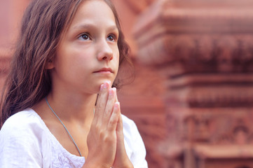 Praying little girl