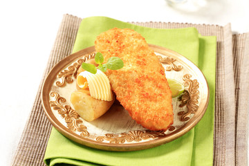 Wall Mural - Fried fish fillet with new potatoes