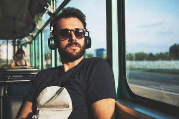 Young man riding in public transport