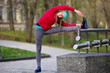 © Елена Кравчук - Healthy young woman stretching in city park, sport lifestyle