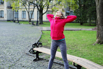 Sports girl before training in the park, healthy lifestyle